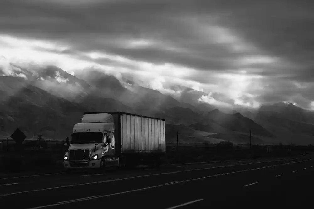Semi truck with container on highway